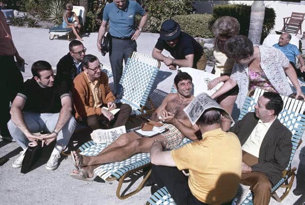 UNITED STATES - JANUARY 10: Football: New York Jets QB Joe Namath casual on beach with media and fans before Super Bowl III game vs Baltimore Colts, View of Brent Musburger (far L), Fort Lauderdale, FL 1/10/1969 (Photo by Walter Iooss Jr./Sports Illustrated/Getty Images) (SetNumber: X13781)