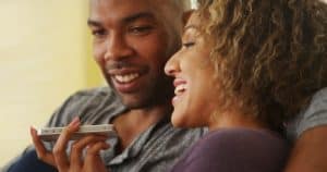 couple-using-iphone-speakerphone-voice-commands-shutterstock-510px