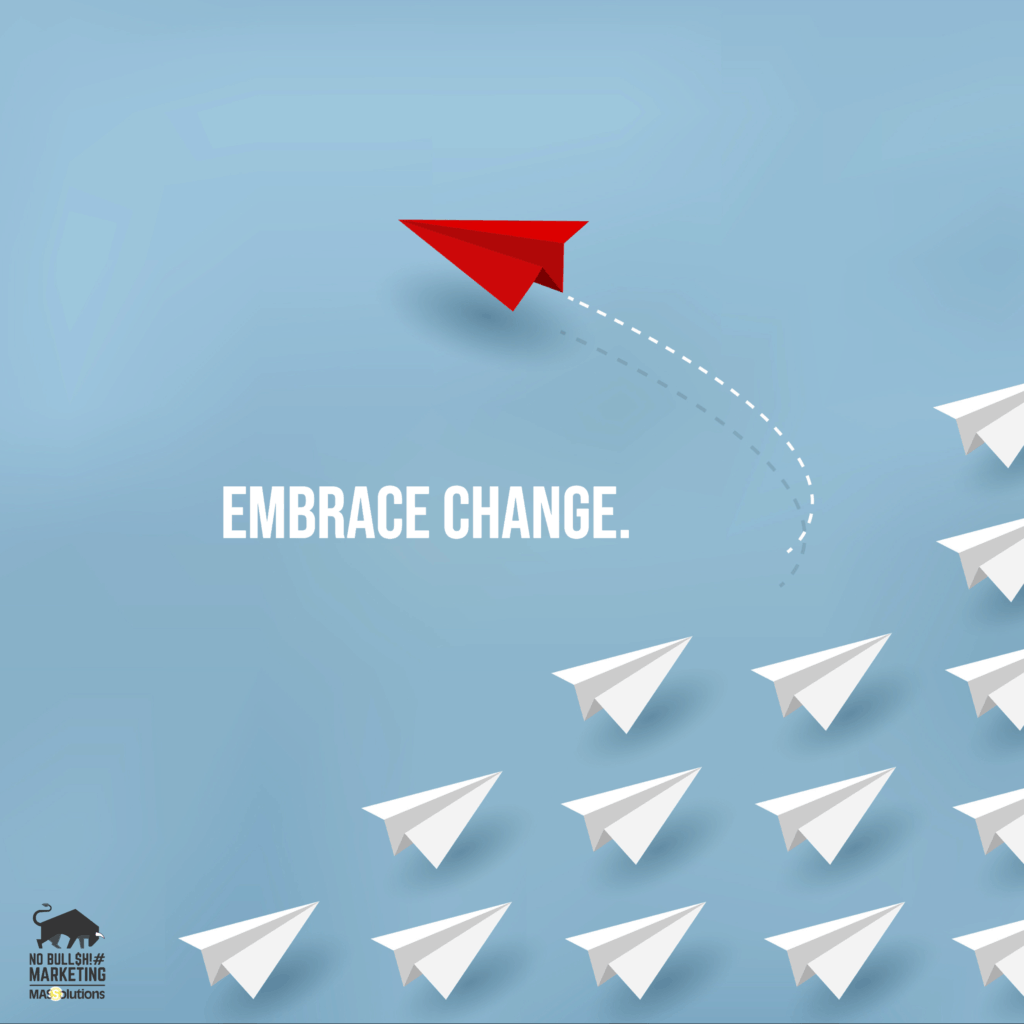 Picture of white paper airplanes going in on direction and a solo red airplane going in another with text, "Embrace Change."