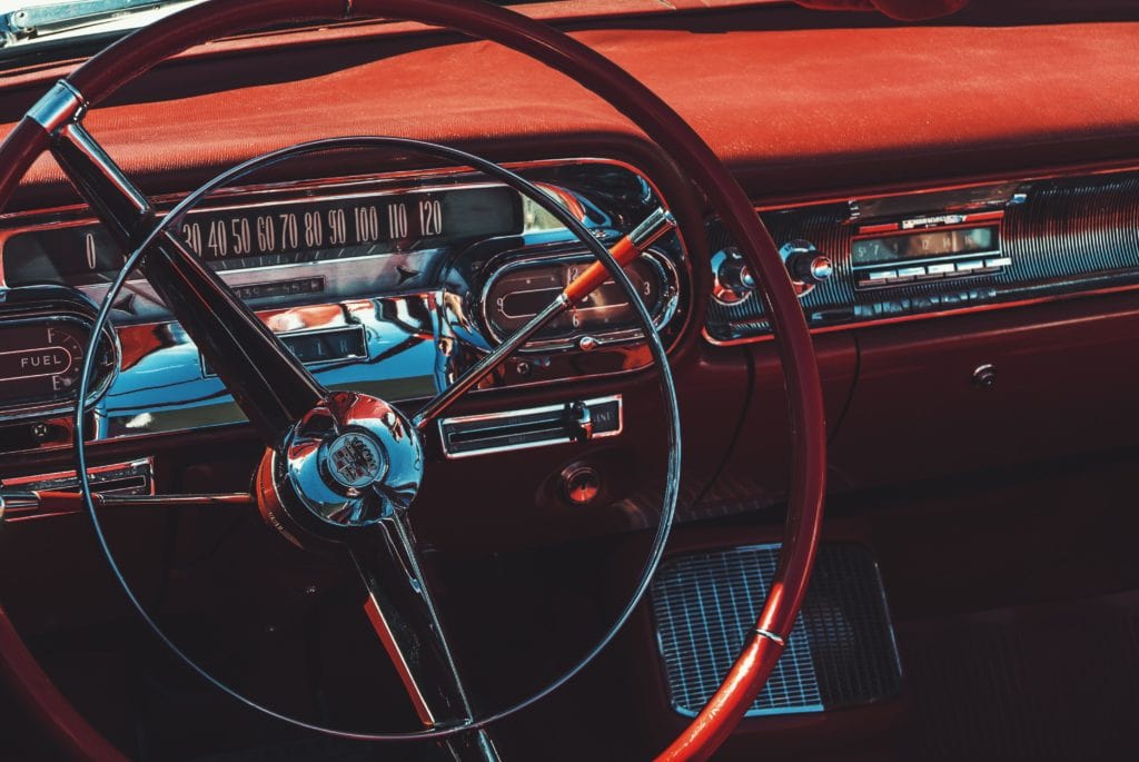 Picture of the interior of an old-school Cadillac